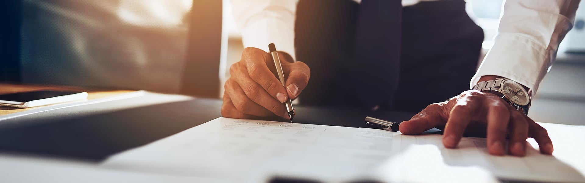 Man signing Car Warranty